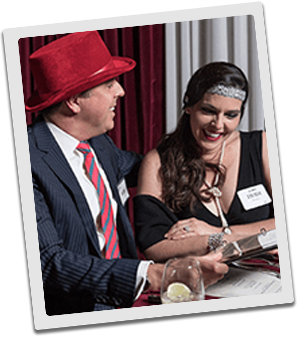Portland Murder Mystery couple checking out the dinner menu